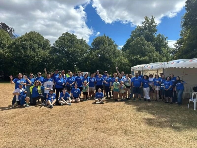 The volunteer team in matching blue Llamau T-shirts at Bubble Rush 2026